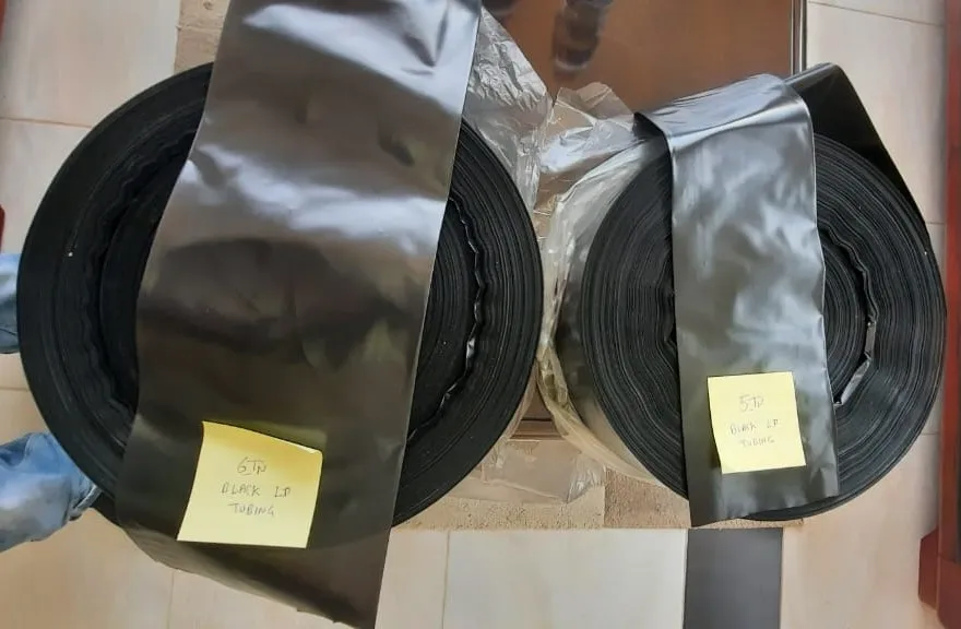 Rolls of black plant nursery tubing