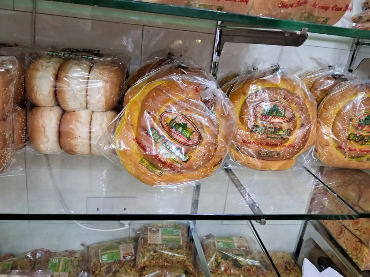 Buns and rolls in printed bread bags on display