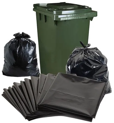 Black garbage bags and a green bin